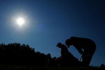 CHASKA, MN - AUGUST 16:  Tiger Woods (R) reacts to his tee shot on the 17th hole as caddie Steve Williams walks off during the final round of the 91st PGA Championship at Hazeltine National Golf Club on August 16, 2009 in Chaska, Minnesota.  (Photo by Stuart Franklin/Getty Images)