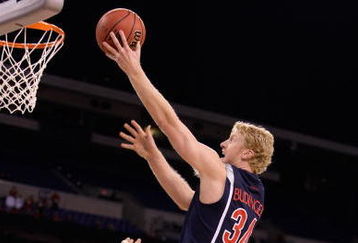 INDIANAPOLIS - MARCH 27:  Chase Budinger #34 of the Arizona Wildcats attempts a shot against the Louisville Cardinals  during the third round of the NCAA Division I Men's Basketball Tournament at the Lucas Oil Stadium on March 27, 2009 in Indianapolis, Indiana.  (Photo by Andy Lyons/Getty Images)