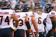 ORCHARD PARK, NY - AUGUST 15:  Jay Cutler #6 of the Chicago Bears huddles with teammates against the Buffalo Bills on  August 15, 2009 at Ralph Wilson Stadium in Orchard Park, New York.  (Photo by Rick Stewart/Getty Images)