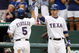 ARLINGTON, TX - JULY 22: Ian Kinsler #5 of the Texas Rangers celebrates his home run with teammate Josh Hamilton #32, tying the game 1-1 during the third inning against the Boston Red Sox at Rangers Ballpark July 22, 2009 in Arlington, Texas. (Photo by Ronald Martinez/Getty Images)
