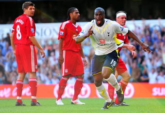 LONDON, ENGLAND - AUGUST 16:  Sebastien Bassong of Tottenham celebrates after scoring his team's second goal on his debut during the Barclays Premier League match between Tottenham Hotspur and Liverpool at White Hart Lane on August 16, 2009 in London, England.  (Photo by Mike Hewitt/Getty Images)