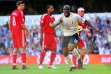 LONDON, ENGLAND - AUGUST 16:  Sebastien Bassong of Tottenham celebrates after scoring his team's second goal on his debut during the Barclays Premier League match between Tottenham Hotspur and Liverpool at White Hart Lane on August 16, 2009 in London, England.  (Photo by Mike Hewitt/Getty Images)