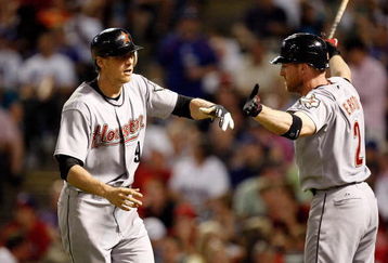 ARLINGTON, TX - JUNE 18:  Hunter Pence #8 of the Houston Astros celebrates a solo homerun with Darin Erstad #2 against the Texas Rangers on June 18, 2009 at Rangers Ballpark in Arlington, Texas.  (Photo by Ronald Martinez/Getty Images)