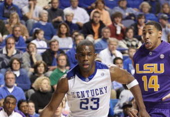 LEXINGTON, KY - FEBRUARY 28:  Jodie Meeks #23 of the Kentucky Wildcats drives to the basket against Garrett Temple #14 of the LSU Tigers during the SEC game at Rupp Arena on February 28, 2009 in Lexington, Kentucky.  (Photo by Andy Lyons/Getty Images)