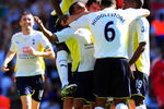 LONDON, ENGLAND - AUGUST 16:  Benoit Assou-Ekotto (3rd L) of Tottenham is congratulated by teammates after scoring the opening goal during the Barclays Premier League match between Tottenham Hotspur and Liverpool at White Hart Lane on August 16, 2009 in London, England.  (Photo by Mike Hewitt/Getty Images)