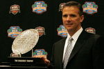 FORT LAUDERDALE, FL - JANUARY 07:  Head coach Urban Meyer of the Florida Gators poses with the 'The Coaches' Trophy' during the FedEx BCS Head Coaches Press Conference at Harbor Beach Marriott Resort & Spa on January 7, 2009 in Fort Lauderdale, Florida.  (Photo by Doug Benc/Getty Images)