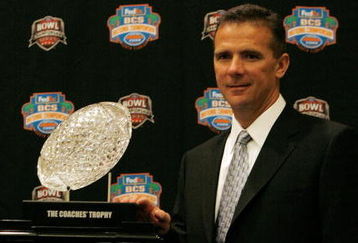 FORT LAUDERDALE, FL - JANUARY 07:  Head coach Urban Meyer of the Florida Gators poses with the 'The Coaches' Trophy' during the FedEx BCS Head Coaches Press Conference at Harbor Beach Marriott Resort & Spa on January 7, 2009 in Fort Lauderdale, Florida.  (Photo by Doug Benc/Getty Images)