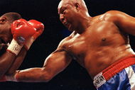 11 Apr 1992: George Foreman makes a right puch during a fight against Alex Stewart. Mandatory Credit: Holly  Stein  /Allsport