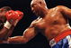 11 Apr 1992: George Foreman makes a right puch during a fight against Alex Stewart. Mandatory Credit: Holly  Stein  /Allsport