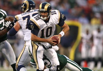 EAST RUTHERFORD, NJ - AUGUST 14: Marc Bulger #10 of the St. Louis Rams is sacked against the New York Jets during their preseason game at Giants Stadium on August 14, 2009  in East Rutherford, New Jersey.  (Photo by Nick Laham/Getty Images)