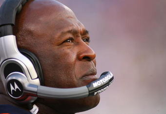 ORCHARD PARK, NY - AUGUST 15: Lovie Smith, head coach of the Chicago Bears watches the scoreboard during a break in play against the Buffalo Bills on  August 15, 2009 at Ralph Wilson Stadium in Orchard Park, New York.  (Photo by Rick Stewart/Getty Images)