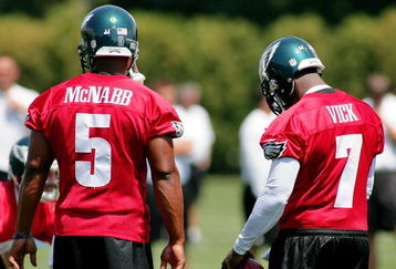 PHILADELPHIA - AUGUST 15:  Donovan McNabb #5 and Michael Vick #7 look on during a workout at the NovaCare Complex on August 15, 2009 in Philadelphia, Pennsylvania.  (Photo by Len Redkoles/Getty Images)