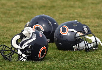 BOURBONNAIS, IL - AUGUST 04: Three Chicago Bears helmuts rest on the field during a training camp practice on August 4, 2009 at Olivet Nazarene University in Bourbonnais, Illinois. (Photo by Jonathan Daniel/Getty Images)