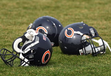BOURBONNAIS, IL - AUGUST 04: Three Chicago Bears helmuts rest on the field during a training camp practice on August 4, 2009 at Olivet Nazarene University in Bourbonnais, Illinois. (Photo by Jonathan Daniel/Getty Images)