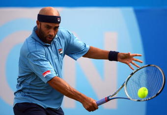 LONDON, ENGLAND - JUNE 14:  James Blake of USA plays a backhand during the men's final match against Andy Murray of Great Britain on Day 7 of the AEGON Championship at Queens Club on June 14, 2009 in London, England.  (Photo by Julian Finney/Getty Images)