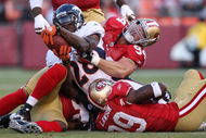 SAN FRANCISCO - AUGUST 14: Running back Correll Buckhalter #28 of the Denver Broncos is tackled by Justin Smith #94 of the San Francisco 49ers during the preseason game on August 14, 2009 at Candlestick Park in San Francisco, California. (Photo by Jed Jacobsohn/Getty Images)
