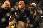 LAS VEGAS - JULY 11:  (2nd R) Georges St. Pierre celebrates his victory against Thiago Alves during their welterweight title bout during UFC 100 on July 11, 2009 in Las Vegas, Nevada. St. Pierre defeated Alves by unanimous decision.  (Photo by Jon Kopaloff/Getty Images)