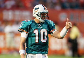 MIAMI - AUGUST 17:  Quarterback Chad Pennington #10 of the Miami Dolphins gives a thumbs up to wide receiver Ted Ginn Jr. #19, after Ginn made a catch while taking on the Jacksonville Jaguars during a preseason game at Landshark Stadium on August 17, 2009 in Miami, Florida.  (Photo by Doug Benc/Getty Images)
