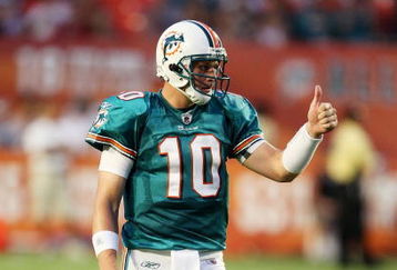 MIAMI - AUGUST 17:  Quarterback Chad Pennington #10 of the Miami Dolphins gives a thumbs up to wide receiver Ted Ginn Jr. #19, after Ginn made a catch while taking on the Jacksonville Jaguars during a preseason game at Landshark Stadium on August 17, 2009 in Miami, Florida.  (Photo by Doug Benc/Getty Images)