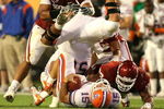MIAMI - JANUARY 08:  Tim Tebow #15 of the Florida Gators is tackled by Gerald McCoy #93 of the Oklahoma Sooners as Maurkice Pouncey #56 of Florida flips over Tebow during the FedEx BCS National Championship game at Dolphin Stadium on January 8, 2009 in Miami, Florida.  (Photo by Doug Benc/Getty Images)