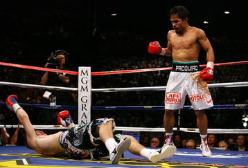 LAS VEGAS - MAY 02:  (R-L) Manny Pacquiao of the Philippines stands over Ricky Hatton of England after Pacquiao knocked him out in the second round during their junior welterweight title fight at the MGM Grand Garden Arena May 2, 2009 in Las Vegas, Nevada.  (Photo by Al Bello/Getty Images)