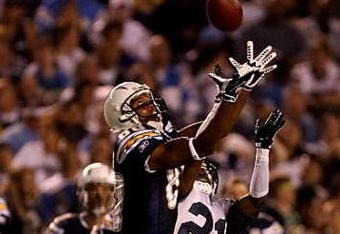 SAN DIEGO - AUGUST 15: Wide receiver Malcom Floyd #80 of the San Diego Chargers jumps to make a catch against cornerback Kelly Jennings #21 of the Seattle Seahawks on August 15, 2009 at Qualcomm Stadium in San Diego, California.    (Photo by Stephen Dunn/Getty Images)