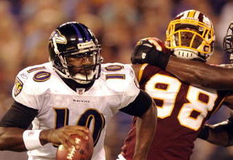 BALTIMORE, MD - AUGUST 13:  Quarterback Troy Smith #10 of the Baltimore Ravens is chased by Brian Orakpo #98 of the Washington Redskins during a NFL preseason football game against the Washington Redskins on August 13, 2009 at M & T Bank Stadium in Baltimore, Maryland.   (Photo by Mitchell Layton/Getty Images)