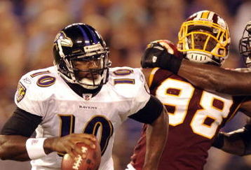 BALTIMORE, MD - AUGUST 13:  Quarterback Troy Smith #10 of the Baltimore Ravens is chased by Brian Orakpo #98 of the Washington Redskins during a NFL preseason football game against the Washington Redskins on August 13, 2009 at M & T Bank Stadium in Baltimore, Maryland.   (Photo by Mitchell Layton/Getty Images)