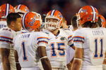 MIAMI - JANUARY 08:  Quarterback Tim Tebow #15 of the Florida Gators huddles against the Oklahoma Sooners during the FedEx BCS National Championship Game at Dolphin Stadium on January 8, 2009 in Miami, Florida.  (Photo by Eliot J. Schechter/Getty Images