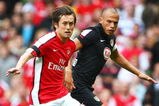 LONDON, ENGLAND - AUGUST 01:  Tomas Rosicky of Arsenal is challenged by John Heitinga of Athletico during the Emirates Cup match between Arsenal and Athletico Madrid at the Emirates Stadium on August 1, 2009 in London, England.  (Photo by Phil Cole/Getty Images)