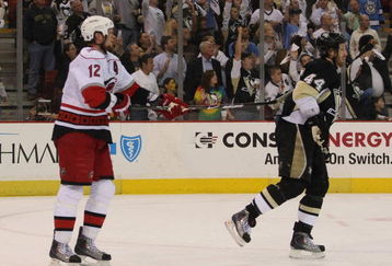 PITTSBURGH - MAY 18:  Eric Staal #12 of the Carolina Hurricanes puts the stick into the back of Brooks Orpik #44 of the Pittsburgh Penguins moments after Game One of the Eastern Conference Championship Round of the 2009 Stanley Cup Playoffs on May 18, 2009 at Mellon Arena in Pittsburgh, Pennsylvania.  (Photo by Bruce Bennett/Getty Images)