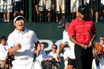 CHASKA, MN - AUGUST 16:  (L-R) Y.E. Yang of South Korea celebrates a birdie putt on the 18th green alongside Tiger Woods during the final round of the 91st PGA Championship at Hazeltine National Golf Club on August 16, 2009 in Chaska, Minnesota.  (Photo by David Cannon/Getty Images)