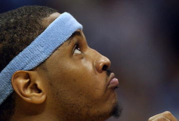 DENVER - MAY 29:  Carmelo Anthony #15 of the Denver Nuggets looks on from the bench in the fourth quarter of Game Six of the Western Conference Finals during the 2009 NBA Playoffs against the Los Angeles Lakers at Pepsi Center on May 29, 2009 in Denver, Colorado. NOTE TO USER: User expressly acknowledges and agrees that, by downloading and or using this photograph, User is consenting to the terms and conditions of the Getty Images License Agreement.  (Photo by Jed Jacobsohn/Getty Images)