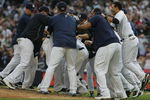 NEW YORK - AUGUST 12:  Members of the New York Yankees celebrate on the mound after Robinson Cano #24 hit a walk-off RBI single in the eleventh inning during the game against the Toronto Blue Jays on August 12, 2009 at Yankee Stadium in the Bronx Borough of New York City. (Photo by Jared Wickerham/Getty Images)