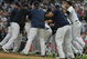 NEW YORK - AUGUST 12:  Members of the New York Yankees celebrate on the mound after Robinson Cano #24 hit a walk-off RBI single in the eleventh inning during the game against the Toronto Blue Jays on August 12, 2009 at Yankee Stadium in the Bronx Borough of New York City. (Photo by Jared Wickerham/Getty Images)