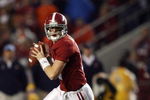 TUSCALOOSA, AL - NOVEMBER 29:  Quarterback Greg McElroy #12 of the Alabama Crimson Tide rolls out to pass against the Auburn Tigers at Bryant-Denny Stadium on November 29, 2008 in Tuscaloosa, Alabama. Alabama defeated Auburn 36-0.  (Photo by Doug Benc/Getty Images)