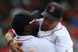 BOSTON - JULY 30:  Designated hitter David Ortiz #34 of the Boston Red Sox hugs teammate Mike Lowell #25 after the victory against the Oakland A's on July 30, 2009 at Fenway Park in Boston, Massachusetts.  (Photo by Elsa/Getty Images)