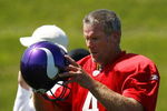 EDEN PRAIRIE, MN - AUGUST 18:  Brett Favre #4 finishes a passing drill during a Minnesota Vikings practice session on August 18, 2009 at Winter Park in Eden Prairie, Minnesota. Favre has reportedly agreed to play for the Vikings, a reversal of his announced retirement.  (Photo by Scott A. Schneider/Getty Images)