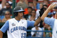 OMAHA, NE - JUNE 21:  First baseman Dustin Ackley #13 of the North Carolina Tar Heels celebrates with teammates after hitting a solo homer in the second inning to the give the Tar Heels a 1-0 lead over the Rice Owls in Game 13 of the NCAA College World Series at Rosenblatt Stadium on June 21, 2007 in Omaha, Nebraska. (Photo by Kevin C. Cox/Getty Images) 