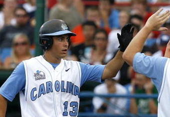 OMAHA, NE - JUNE 21:  First baseman Dustin Ackley #13 of the North Carolina Tar Heels celebrates with teammates after hitting a solo homer in the second inning to the give the Tar Heels a 1-0 lead over the Rice Owls in Game 13 of the NCAA College World Series at Rosenblatt Stadium on June 21, 2007 in Omaha, Nebraska. (Photo by Kevin C. Cox/Getty Images) 