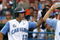 OMAHA, NE - JUNE 21:  First baseman Dustin Ackley #13 of the North Carolina Tar Heels celebrates with teammates after hitting a solo homer in the second inning to the give the Tar Heels a 1-0 lead over the Rice Owls in Game 13 of the NCAA College World Series at Rosenblatt Stadium on June 21, 2007 in Omaha, Nebraska. (Photo by Kevin C. Cox/Getty Images) 