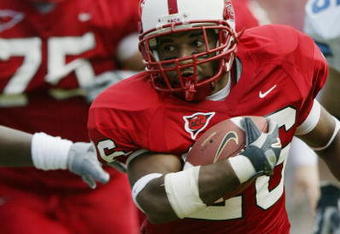 RALEIGH, NC - SEPTEMBER 27:  Tailback Josh Brown #26 of the North Carolina State University Wolfpack carries the ball against the University of North Carolina Tar Heels during the game at Carter Finley Stadium on September 27, 2003 in Raleigh, North Carolina.  N.C. State defeated UNC 47-34.  (Photo by Craig Jones/Getty Images)