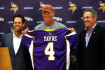EDEN PRAIRIE, MN - AUGUST 18: Brett Favre (C), Mark Wilf (L) and Zygi Wilf show the media Favre's Minnesota Vikings jersey on August 18, 2009 at Winter Park in Eden Prairie, Minnesota. (Photo by Scott A. Schneider/Getty Images)
