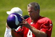 EDEN PRAIRIE, MN - AUGUST 18:  Brett Favre #4 finishes a passing drill during a Minnesota Vikings practice session on August 18, 2009 at Winter Park in Eden Prairie, Minnesota. Favre has reportedly agreed to play for the Vikings, a reversal of his announced retirement.  (Photo by Scott A. Schneider/Getty Images)