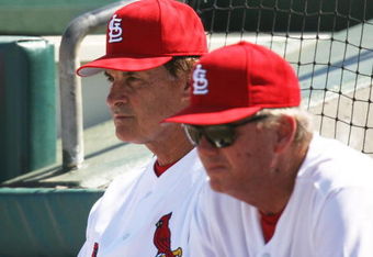 JUPITER, FL - MARCH 2:  Manager Tony La Russa #10 (L) and pitching coach Dave Duncan #18 of the St. Louis Cardinals watch as the New York Mets take a four run lead in the first inning during a spring training game at Roger Dean Stadium on March 2, 2006 in Jupiter, Florida. The Mets defeated the Cards 12-7.  (Photo by Doug Benc/Getty Images)
