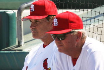 JUPITER, FL - MARCH 2:  Manager Tony La Russa #10 (L) and pitching coach Dave Duncan #18 of the St. Louis Cardinals watch as the New York Mets take a four run lead in the first inning during a spring training game at Roger Dean Stadium on March 2, 2006 in Jupiter, Florida. The Mets defeated the Cards 12-7.  (Photo by Doug Benc/Getty Images)