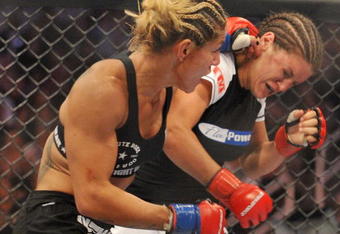 SAN JOSE, CA - AUGUST 15:  Cris Cyborg (L) battles Gina Carano during their Middleweight Championship fight at Stikeforce: Carano vs. Cyborg on August 15, 2009 in San Jose, California.  (Photo by Jon Kopaloff/Getty Images)