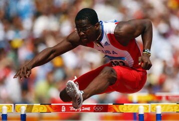 BEIJING - AUGUST 18:  Dayron Robles of Cuba competes in the Men's 110m Hurdles Heats  at the National Stadium on Day 10 of the Beijing 2008 Olympic Games on August 18, 2008 in Beijing, China.  (Photo by Michael Steele/Getty Images)