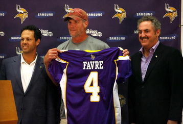 EDEN PRAIRIE, MN - AUGUST 18: Brett Favre (C), Mark Wilf (L) and Zygi Wilf show the media Favre's Minnesota Vikings jersey on August 18, 2009 at Winter Park in Eden Prairie, Minnesota. (Photo by Scott A. Schneider/Getty Images)