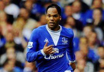 LIVERPOOL, ENGLAND - AUGUST 15:   Joleon Lescott  of Everton runs with the ball during the Barclays Premier League match between Everton and Arsenal at Goodison Park on August 15, 2009 in Liverpool, England. (Photo by Michael Regan/Getty Images)